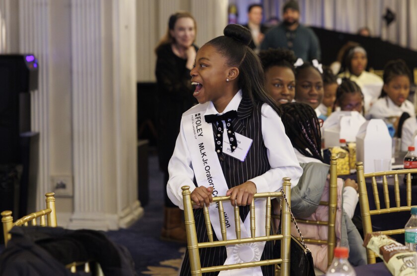 Alanna Atwood celebrates her win during the 7th annual MLK Jr. Oratory Competition at The Duke Hotel.