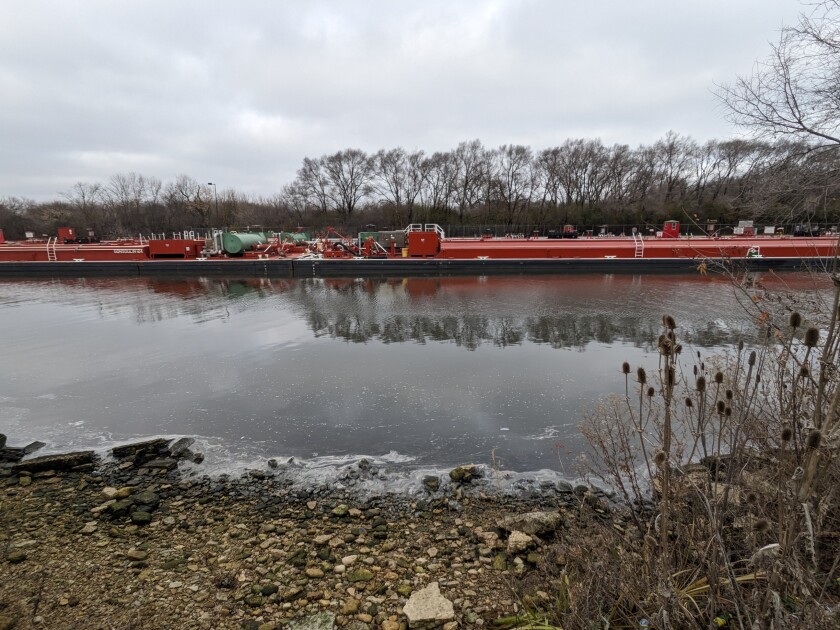 A barge on the way out of the Brandon Road Lock Wednesday during a tour of the peninsula that will be the center of the $1.1 billion Brandon Road Interbasin Project to keep from invasive species, especially invasive carp, from advancing to the Great Lakes.