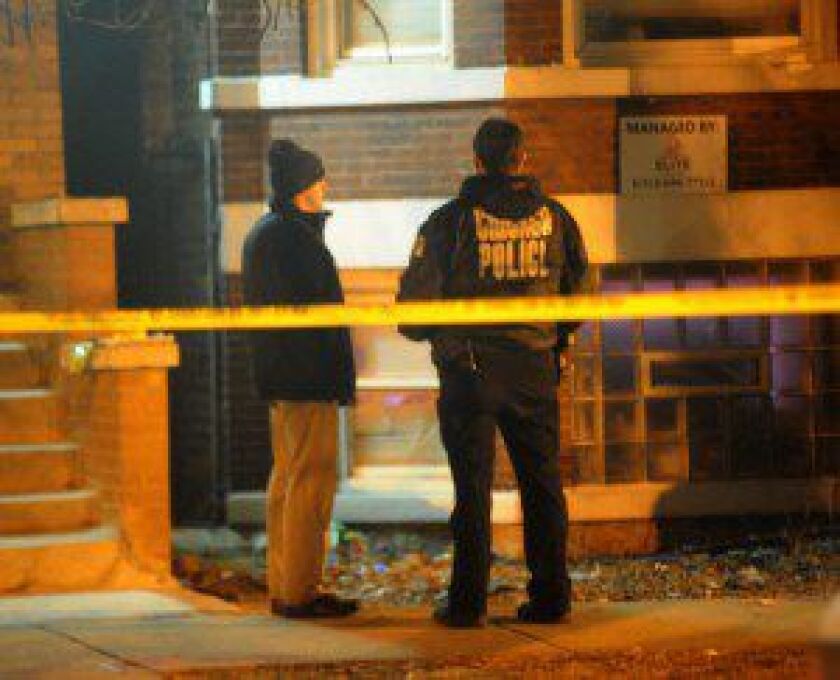 Officers respond to a fatal stabbing early Saturday in the 6900 block of Michigan Avenue. | Justin Jackson/Sun-Times