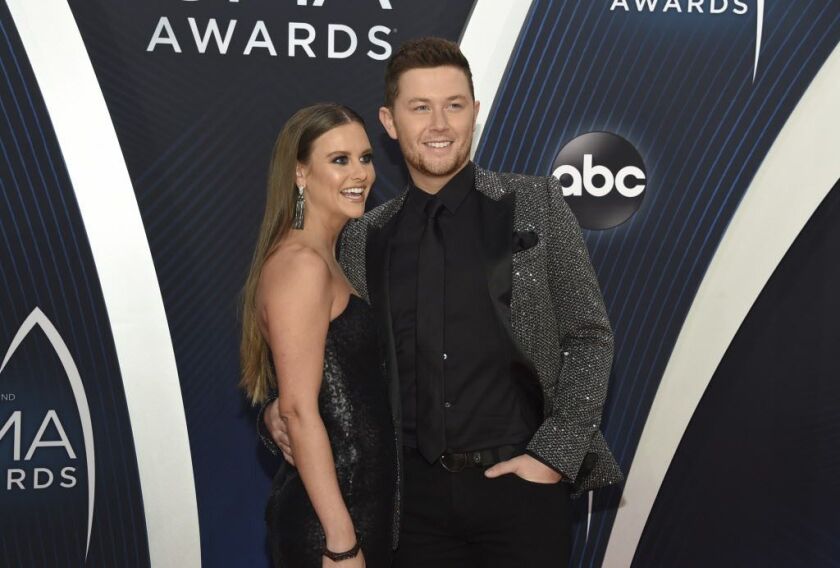 Scotty McCreery and Gabi Dugal arrive at the CMA Awards at Bridgestone Arena on Nov. 14, 2018, in Nashville. | AP