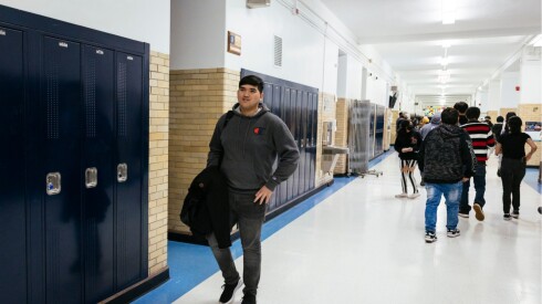 Aziz in the hallways at Sullivan High School in Roger Park between classes.