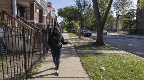 Tosheika Thomas walks through her childhood neighborhood of West Garfield in Chicago on November 1, 2025. | Manuel Martinez/WBEZ