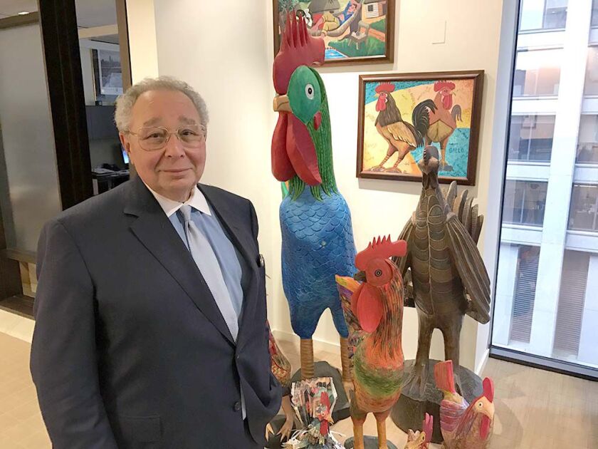 Norm Bobins has a colorful collection of roosters — paper-mache, metal and painted works. | Shia Kapos/Sun-Times