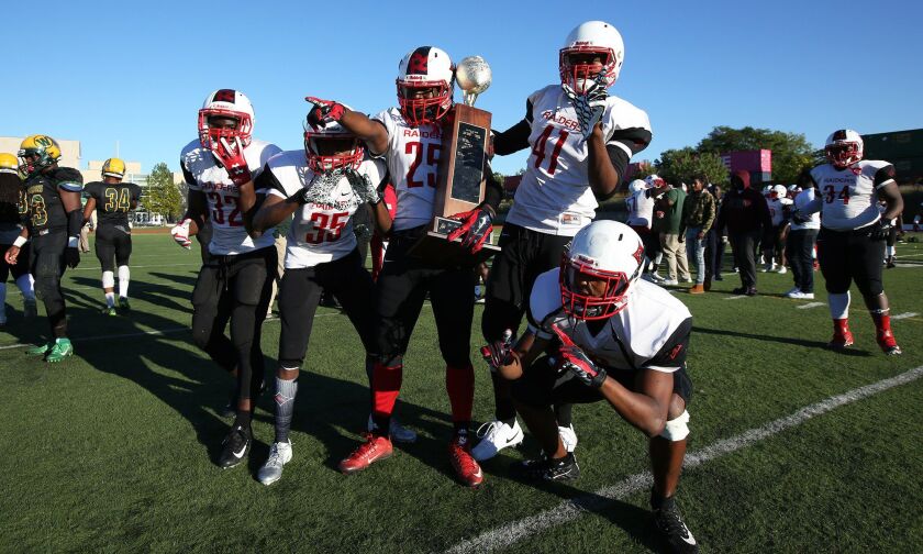 Raby’s Romel Goston (25) celebrates with his teammates. Allen Cunningham/For the Sun-Times.