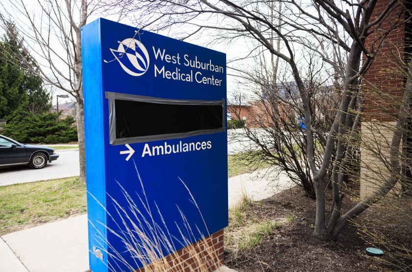 Black plastic covers the emergency room signs at West Suburban Medical Center in Oak Park on Wednesday.