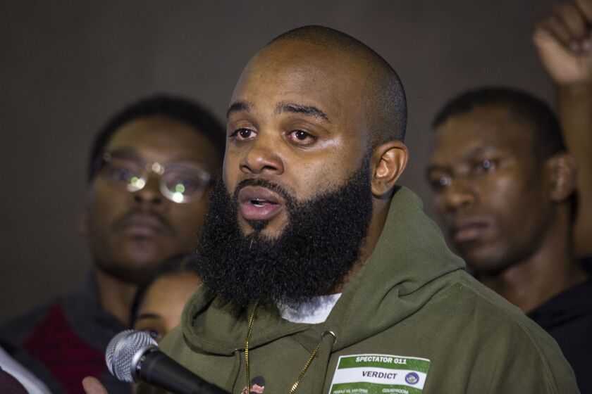 Community activist William Calloway speaks to reporters at the Leighton Criminal Court Building in October. File Photo. | Ashlee Rezin/Chicago Sun-Times