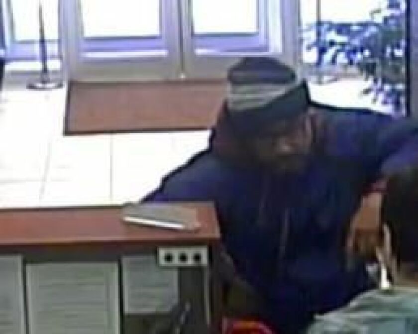 Surveillance image of the suspect in a robbery Feb. 15 at the Hoyne Savings Bank branch at 4786 N. Milwaukee Ave. | FBI