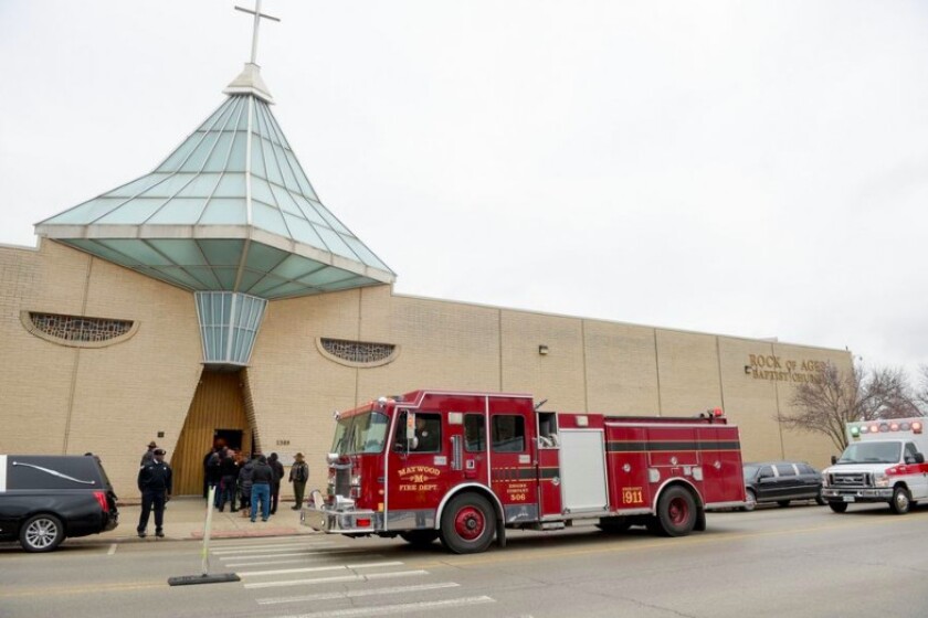 The Maywood Fire Department proceeds by the Rock of Ages Baptist Church in honor of retired Illinois State Police Trooper Gregory Rieves before his funeral Saturday in Maywood.