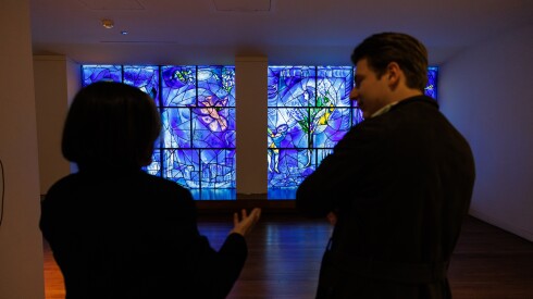 Rebecca J. Long, Patrick G. and Shirley W. Ryan Curator, (left) and Klaus Makela, Music Director of the CSO, speak about the “America Window” by Marc Chegall at the Art Institute of Chicago, Tuesday, Feb. 17, 2026.