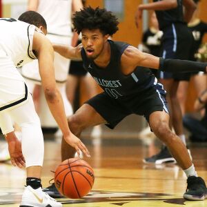 Hillcrest’s Kenton Wright tightens the defense in the third quarter.