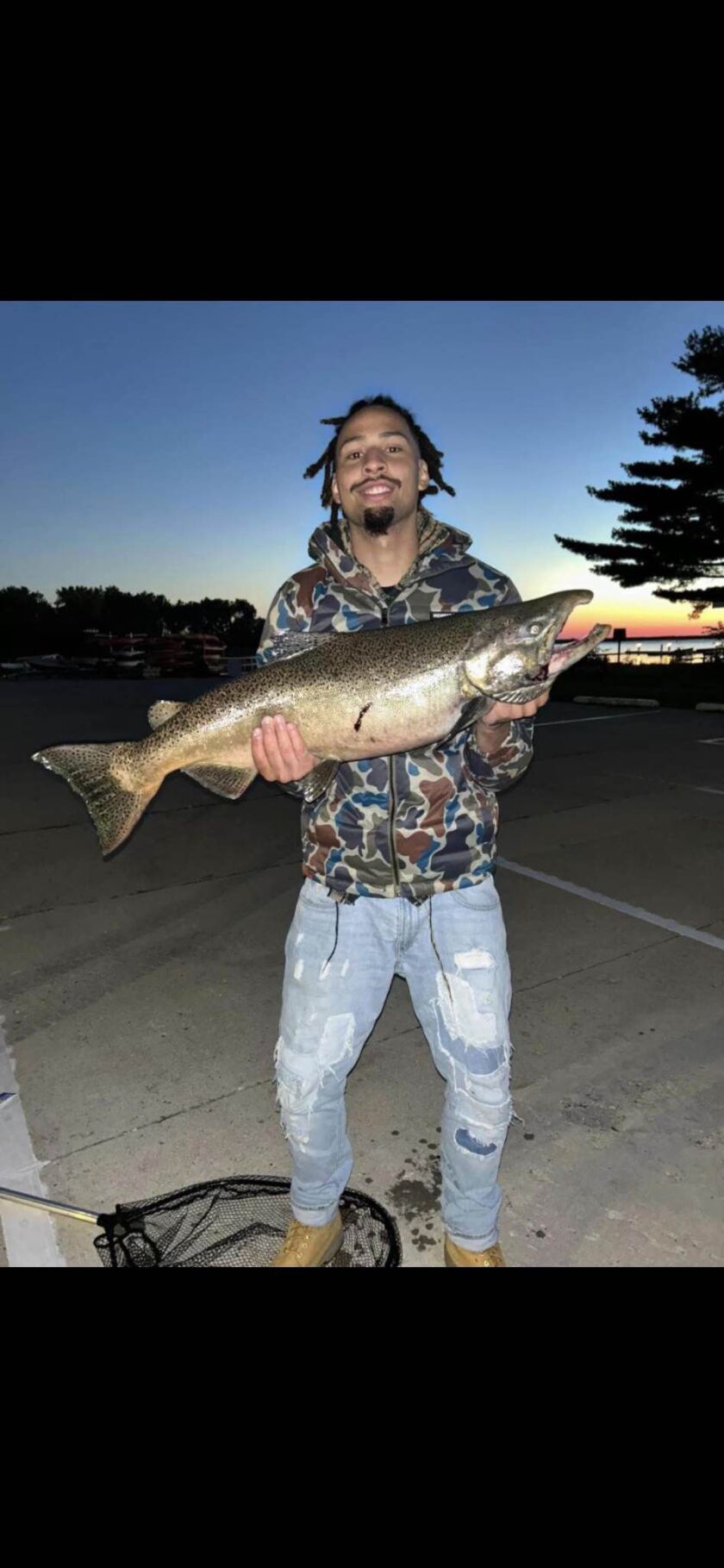 Anthony “Tony” Johnson with one of the salmon he caught at Great Lakes Naval. Provided photo