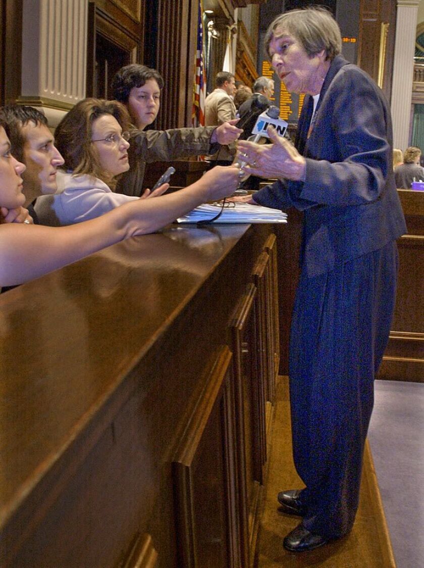 House Majority Leader Barbara Flynn Currie, D-Chicago, stands up on the House pages’ bench to speak to reporters in 2004. | Seth Perlman/AP file photo