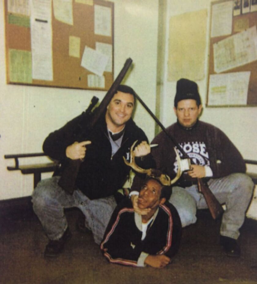 Chicago Police officers Jerome Finnigan (left) and Timothy McDermott with Michael Spann. | Photo from court file