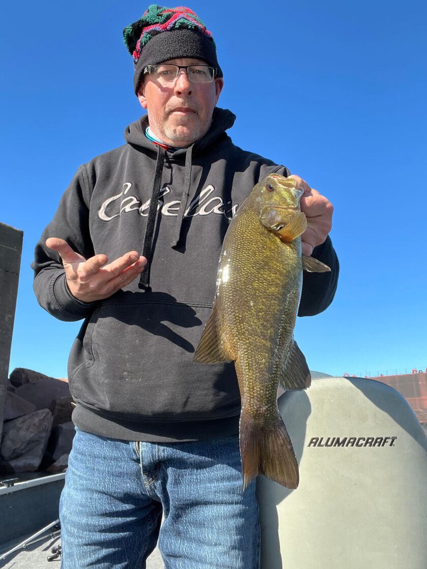 James Baranski with a good smallmouth bass from southern Lake Michigan. Provided photo