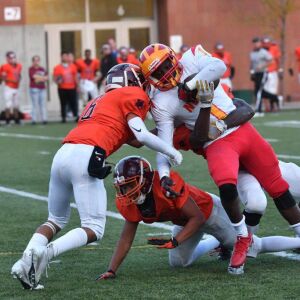 North Lawndale’s LeDarius Toliver (1) gets pulled down. Worsom Robinson/For the Sun-Times.