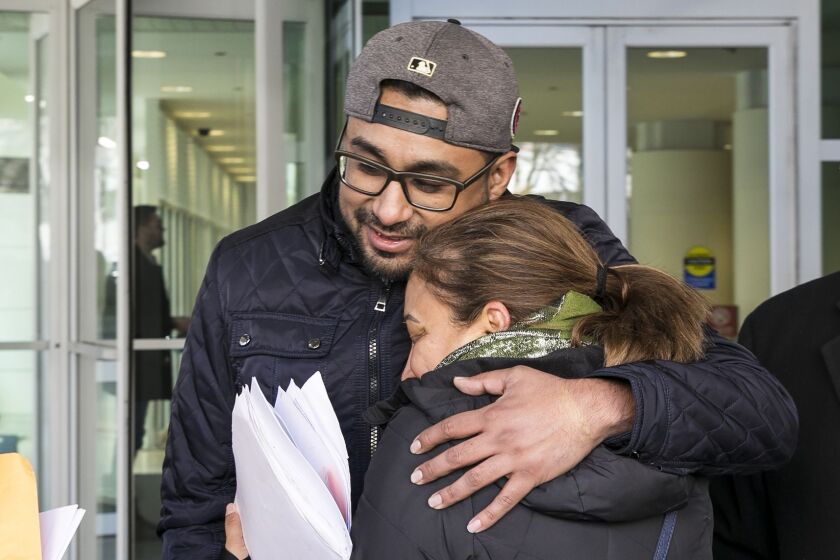 Christian Gomez Garcia, 29, hugs his mother, Luz Maria Garcia, outside the Chicago Field Office after he was released from an ICE detention center Thursday morning. Gomez Garcia, a DACA recipient, was taken into custody at Cook County Circuit Court in Sko