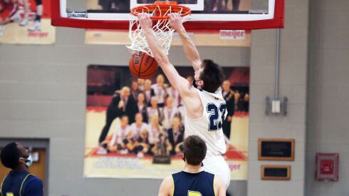 New Trier’s Jake Fiegen (23) dunks against Yorkville Christian.