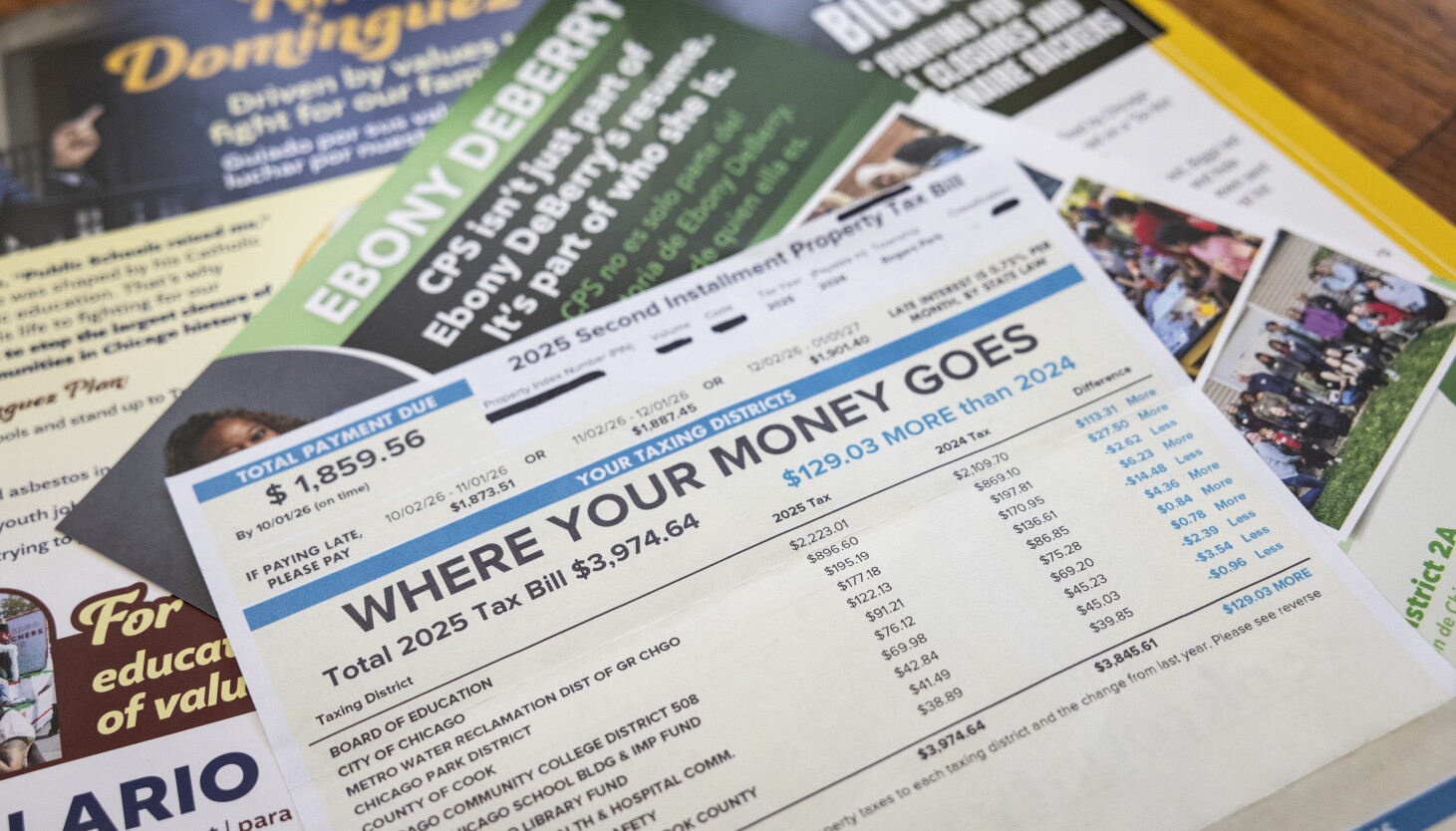 A Cook County 2025 second installment property tax bill and Chicago Board of Education election flyers.