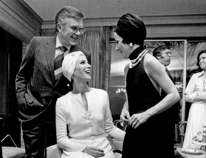 Mary Frey and her husband, Donald N. Frey, chairman and president of Bell & Howell, moved in the same circles she would cover as Sun-Times society columnist. Here, Donald Frey is in a 1975 photo shoot celebrating “the return to evening hats” at a part