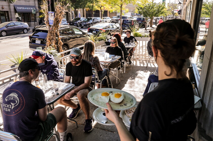 Patrons enjoy breakfast on Friday morning on the patio of Southport Grocery and Cafe, 3552 N. Southport Ave. The neighborhood fixture will close Dec. 31 to make way for a Dollop Finer Diner opening in early 2027.
