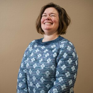 Carly Olig, who traveled from Madison, Wisc., wears a sweater that was designed by Amy Christoffers and knitted by Olig during the 19th YarnCon at the Plumbers Union Hall in the Near West Side on Saturday.