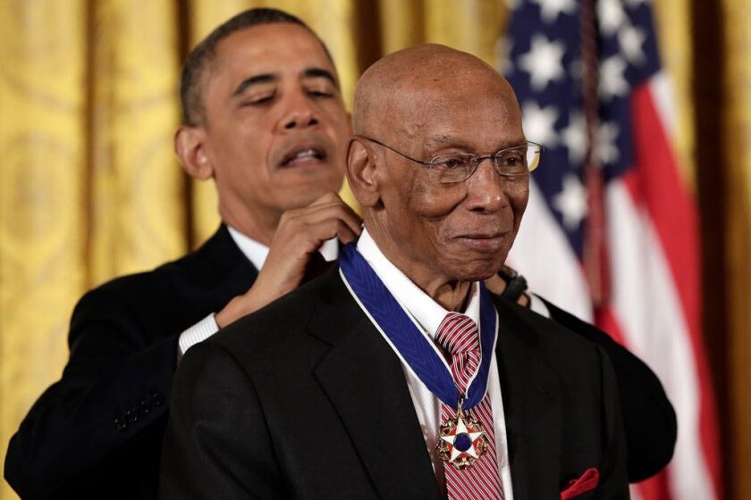 U.S. President Barack Obama awards the Presidential Medal of Freedom to Hall of Fame baseball player Ernie Banks in the East Room at the White House on November 20, 2013 in Washington, DC. (Photo by Win McNamee/Getty Images)