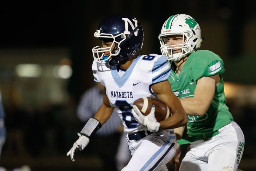 Nazareth’s Tyler Morris (8) runs the ball against Notre Dame.