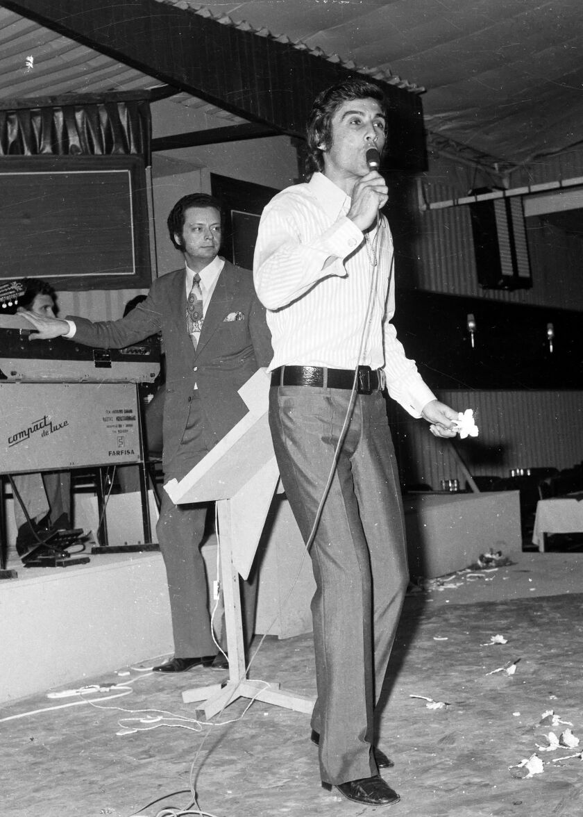 In this June 13, 1971, file photo, Greek popular folk singer Tolis Voskopoulos performs at a music hall in Athens, Greece.