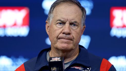 A photo of Patriots coach Bill Belichick listening to a question at a recent news conference.