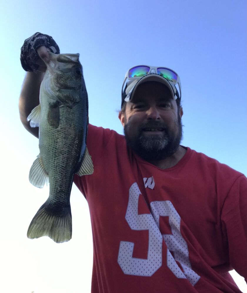 Ken “Husker” O’Malley with a local largemouth bass. Provided
