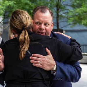 Former Ald. Patrick Daley Thompson (11th) hugs a supporter as he walks out of the Dirksen Federal Courthouse after being sentenced to four months in federal prison, Wednesday morning, July 6, 2022. A jury convicted Thompson in February of cheating on his taxes and lying to federal regulators.