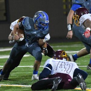 Taft’s Roberto Salgado (26) barrels his way to a first down. Worsom Robinson/For the Sun-Times.