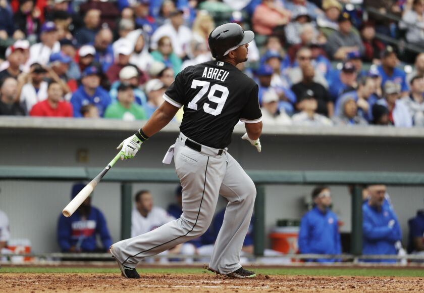 Jose Abreu hits a two-run home run during the fifth inning.