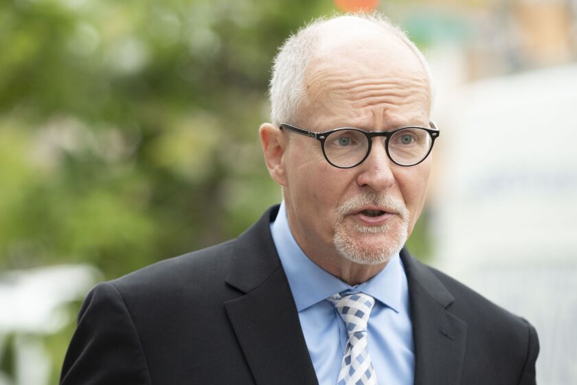 Mayoral candidate Paul Vallas talks to reporters at 78th and Halsted outside a Chicago Police district headquarters on Monday morning. Inside, Mayor Rahm Emanuel and CPD Supt. Eddie Johnson were holding a news conference to discuss the level of gun violen