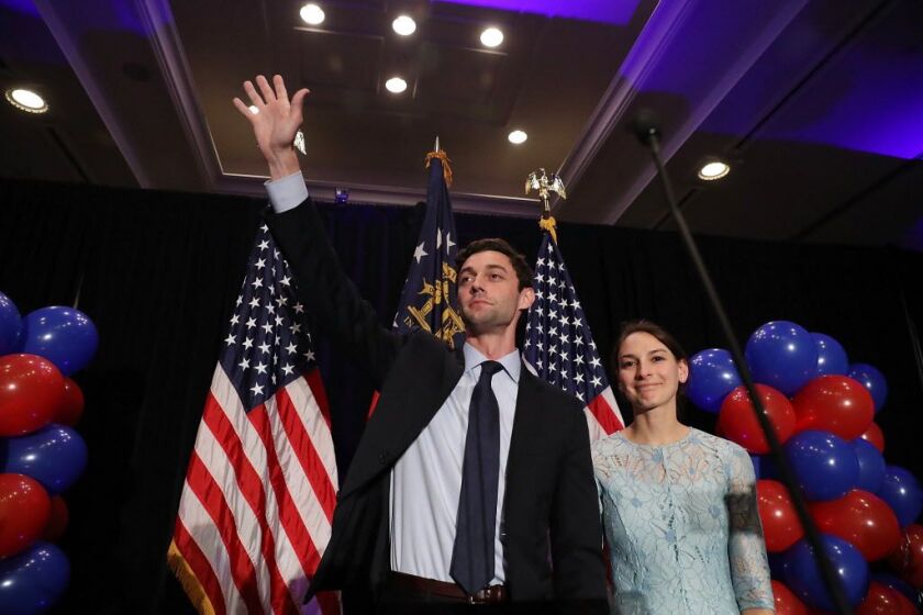 Democratic candidate Jon Ossoff and and his fiancee, Alisha Kramer, exit after he gave a concession speech during his election night party held at the Westin Atlanta Perimeter North Hotel after returns show him losing the race for Georgia’s 6th Congressio