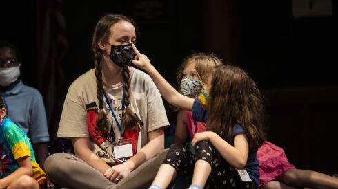 Grace Law, 24, chats with campers at the Hearts to Art summer camp, run by the Auditorium Theatre.