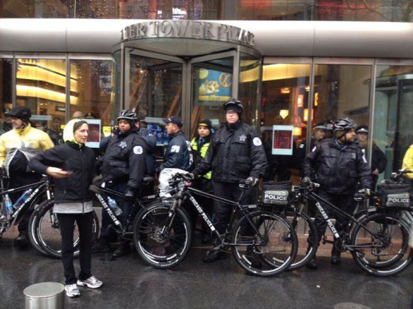 Police block Laquan McDonald protesters who tried to enter Water Tower Place / Dan Mihalopoulos
