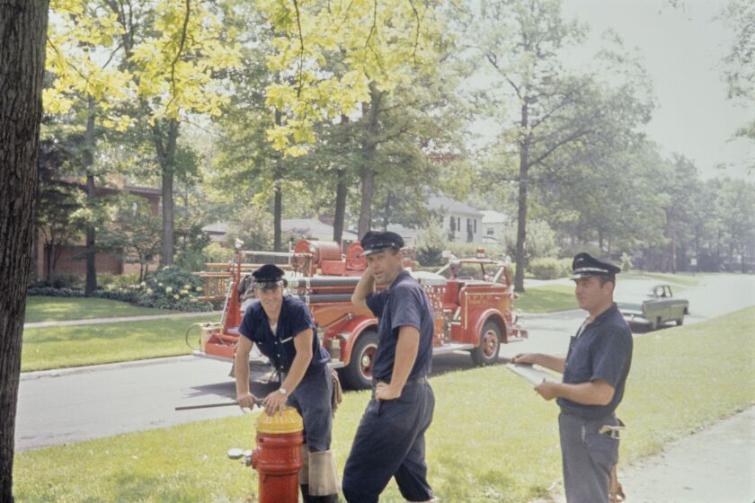 Three Highland Park firemen Highland Park, Illinois, August 1964 Tres bomberos de Highland Park Highland Park, Illinois, agosto de 1964 Inkjet print, 2021 Gift of Jeffrey Goldstein, © The Estate of Vivian Maier 