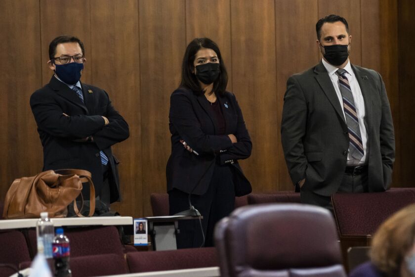 Ald. Raymond Lopez (15th), Ald. Silvana Tabares (23rd) and Ald. Anthony Napolitano (41st) attend a Chicago City Council meeting at City Hall on Monday, Oct. 25, 2021.