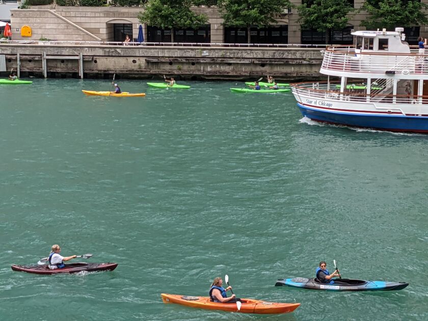 The Chicago River downtown on the main stem is a confluence of many users, including kayakers, tour boats and anglers. Credit: Dale Bowman