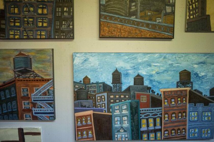 In his paintings, artist Kevin Swallow has immortalized many of Chicago’s rooftop water tanks. | Saiyna Bashir/Sun-Times