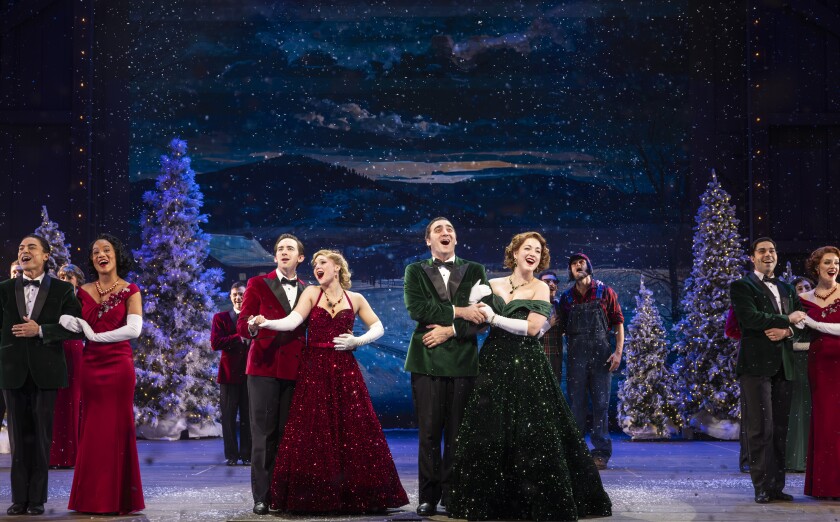 Evan C. Dolan (Phil Davis), Jessie J. Potter (Judy Haynes, both in red), Alex Syiek (Bob Wallace) and Sophie Grimm (Betty Haynes, both in green) lead the cast in the finale of Irving Berlin’s White Christmas.