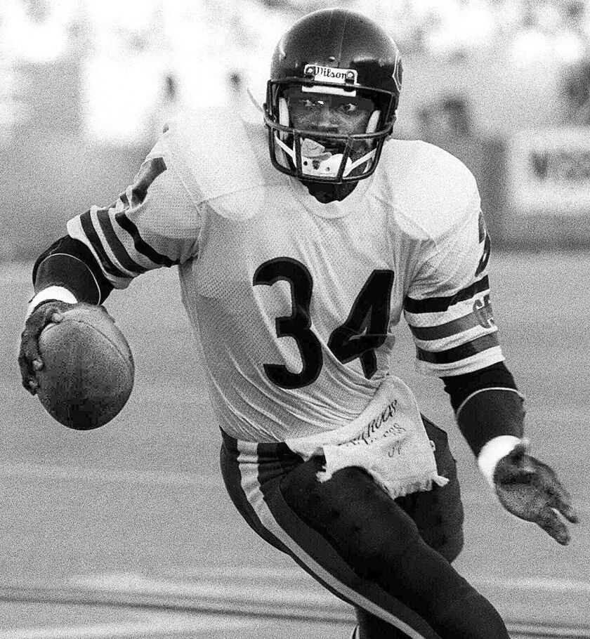 Walter Payton carrying the ball at Soldier Field in 1985.