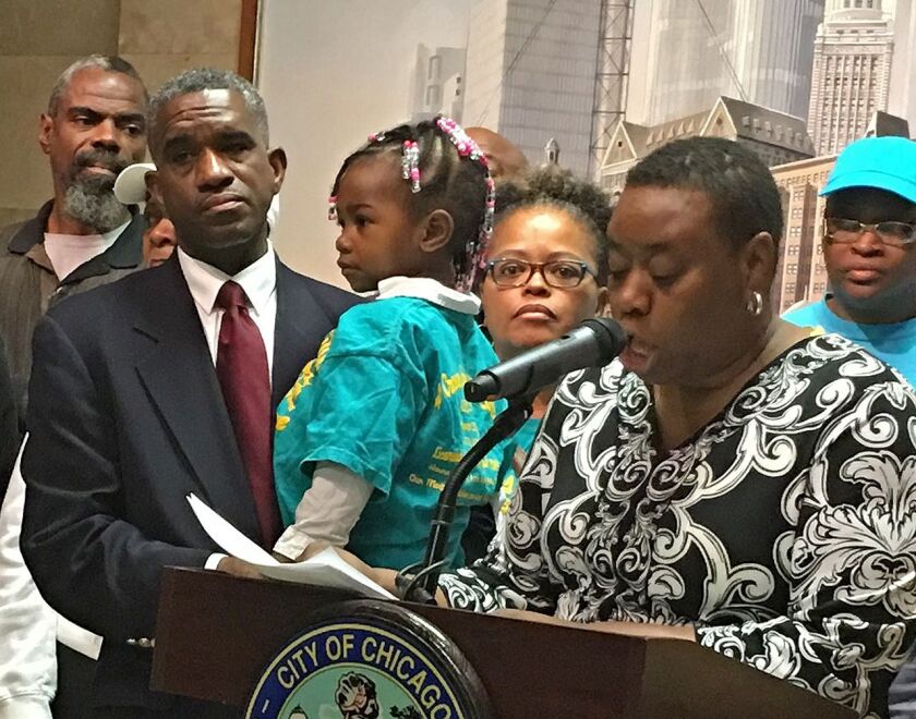 Ald. David Moore (17th) holds 2-year-old Averie Mitchell of North Lawndale during a City Hall news conference Monday called to turn up the heat on the Illinois General Assembly to reverse Gov. Bruce Rauner’s child care cuts. | Fran Spielman/Sun-Times