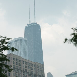 The John Hancock Building is obscured by air pollution driven by the wildfires in Canada on Friday.