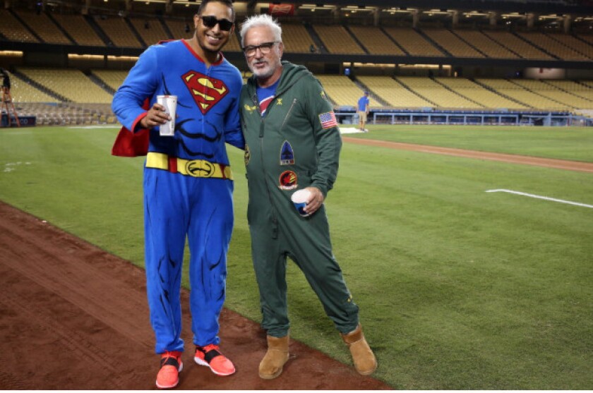 Joe Maddon with Hector Rondon on the Cubs’ onesie-themed trip home from Los Angeles in 2015.