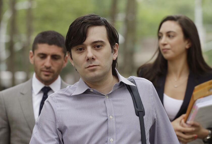 Former Turing Pharmaceuticals CEO Martin Shkreli is shown last week arriving federal court in Brooklyn with members of his legal team for a pretrial conference in his securities fraud trial. Shkreli’s trial begins Monday. | Mark Lennihan/Associated Press