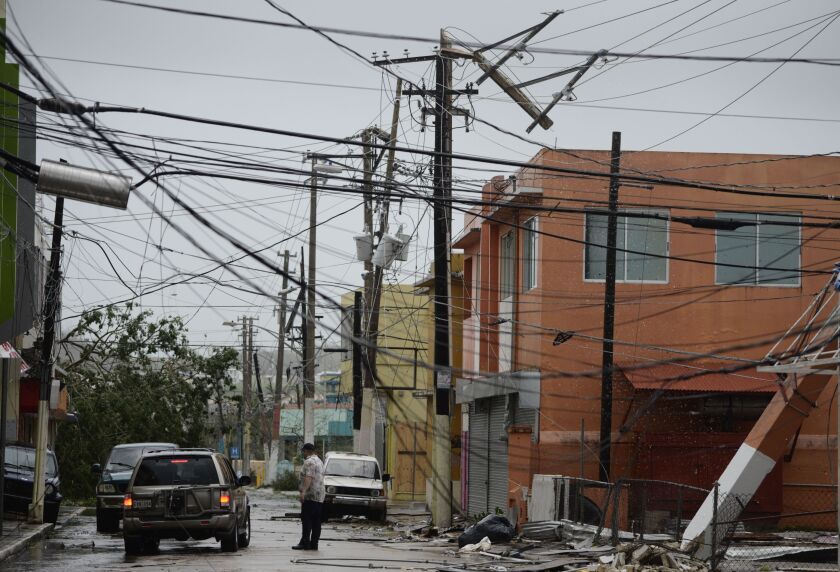 Power lines are down after the impact of Hurricane Maria, which hit the eastern region of the island in Humacao, Puerto Rico. | Carlos Giusti/Associated Press