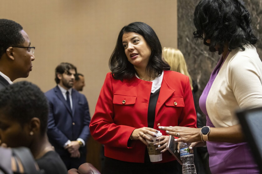 Chicago City Clerk Anna Valencia (center) chats with Ald. Jason Ervin (28th) and City Treasurer Melissa Conyears-Ervin after Mayor Brandon Johnson unveiled his proposed 2025 budget on Oct. 30, 2024.
