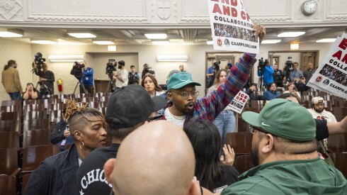 Chicago Public School security officials forcibly remove activists who disrupted a meeting of the Community Commission for Public Safety and Accountability on Thurdsay. The commission called a special meeting with Chicago Police Supt. Larry Snelling at Thomas Kelly College Preparatory High School, 4136 S. California Ave., in the Brighton Park neighborhood, Thursday, April 2, 2026.